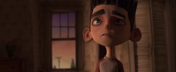 Movie still from “ParaNorman” (2012), directed by Sam Fell – A cartoon of a boy with a sad look on his face; Close Up shot, Low angle