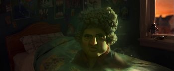 Movie still from “ParaNorman” (2012), directed by Sam Fell – A woman in a wig and a red shirt is sitting on a bed; Close Up shot, High angle