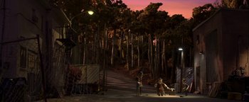 Movie still from “ParaNorman” (2012), directed by Sam Fell – A group of people standing next to a forest at night; Extreme Wide shot, High angle