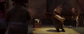 Movie still from “ParaNorman” (2012), directed by Sam Fell – An animated scene of a man with a camera; Wide shot, Low angle