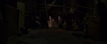 Movie still from “ParaNorman” (2012), directed by Sam Fell – A person standing in a dark room near a window; Wide shot, High angle