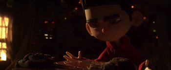 Movie still from “ParaNorman” (2012), directed by Sam Fell – A doll's face in a dark room; Close Up shot, Over the shoulder angle