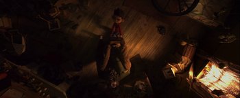 Movie still from “ParaNorman” (2012), directed by Sam Fell – A doll sitting on the floor in a dark room; Wide shot, Overhead angle