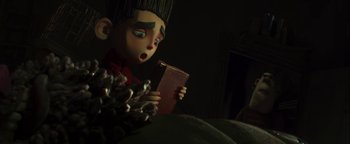 Movie still from “ParaNorman” (2012), directed by Sam Fell – A cartoon character holding a book; Close Up shot, Over the shoulder angle