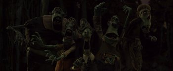Movie still from “ParaNorman” (2012), directed by Sam Fell – A group of people that are standing in the dark; Medium shot, Low angle