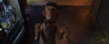 Movie still from “ParaNorman” (2012), directed by Sam Fell – A man with long hair and a beard standing in a dark room; Medium shot, Low angle