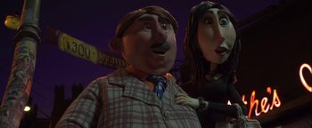 Movie still from “ParaNorman” (2012), directed by Sam Fell – A person wearing a suit and tie; Medium shot, Low angle