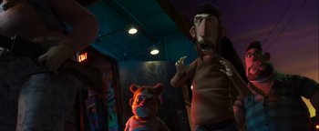 Movie still from “ParaNorman” (2012), directed by Sam Fell – A man and a child are standing in a dark room; Medium shot, Low angle