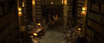 Movie still from “ParaNorman” (2012), directed by Sam Fell – A group of people sitting in a room filled with papers; Extreme Wide shot, High angle