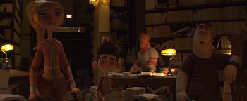 Movie still from “ParaNorman” (2012), directed by Sam Fell – A couple of people sitting at a table with some books; Medium shot, High angle
