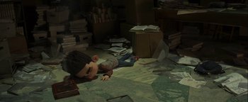 Movie still from “ParaNorman” (2012), directed by Sam Fell – An image of a boy laying on the floor; Wide shot, High angle