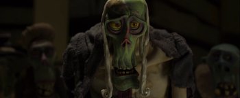 Movie still from “ParaNorman” (2012), directed by Sam Fell – A creepy green skull with long white hair and yellow eyes; Close Up shot, Low angle