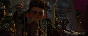 Movie still from “ParaNorman” (2012), directed by Sam Fell – A toy head with other toys in the background; Close Up shot, Low angle
