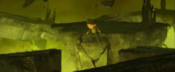 Movie still from “ParaNorman” (2012), directed by Sam Fell – A small toy figure standing on top of a rock pile; Wide shot, Overhead angle