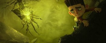 Movie still from “ParaNorman” (2012), directed by Sam Fell – A person's face in a green background; Medium shot, Low angle