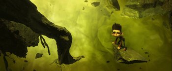 Movie still from “ParaNorman” (2012), directed by Sam Fell – A green background with rocks and a boy in the water; Wide shot, Overhead angle