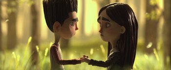 Movie still from “ParaNorman” (2012), directed by Sam Fell – A boy and a girl holding hands in a field; Close Up shot, Over the shoulder angle