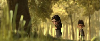 Movie still from “ParaNorman” (2012), directed by Sam Fell – A little girl is standing in a forest; Close Up shot, Over the shoulder angle