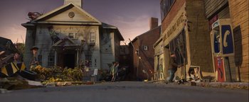 Movie still from “ParaNorman” (2012), directed by Sam Fell – A group of people standing on the side of a road; Extreme Wide shot, High angle