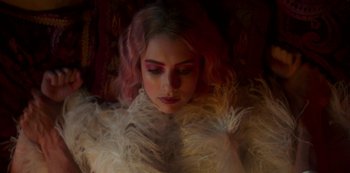 Movie still from “Paradise Hills” (2019), directed by Alice Waddington – A woman with pink hair and a white dress; Close Up shot, Low angle