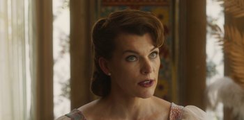 Movie still from “Paradise Hills” (2019), directed by Alice Waddington – A person wearing a dress; Close Up shot, Over the shoulder angle