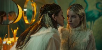 Movie still from “Paradise Hills” (2019), directed by Alice Waddington – Two women are looking at each other in a room; Close Up shot, Over the shoulder angle