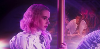Movie still from “Paradise Hills” (2019), directed by Alice Waddington – A woman in a white shirt and a pink tie; Medium shot, Low angle