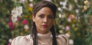 Movie still from “Paradise Hills” (2019), directed by Alice Waddington – A person wearing a dress; Close Up shot, Over the shoulder angle