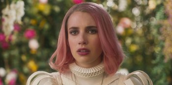 Movie still from “Paradise Hills” (2019), directed by Alice Waddington – A person with pink hair; Close Up shot, Over the shoulder angle