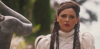 Movie still from “Paradise Hills” (2019), directed by Alice Waddington – A person wearing a costume; Close Up shot, Over the shoulder angle