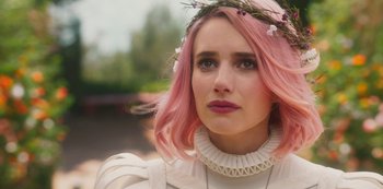 Movie still from “Paradise Hills” (2019), directed by Alice Waddington – A person with pink hair; Close Up shot, Over the shoulder angle