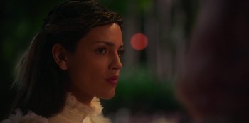 Movie still from “Paradise Hills” (2019), directed by Alice Waddington – A person wearing a white dress; Close Up shot, Over the shoulder angle