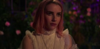 Movie still from “Paradise Hills” (2019), directed by Alice Waddington – A person with pink hair; Close Up shot, Over the shoulder angle