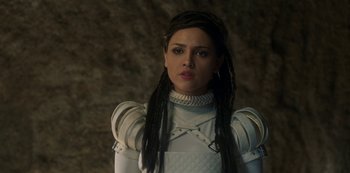 Movie still from “Paradise Hills” (2019), directed by Alice Waddington – A woman in a white outfit with long black hair; Close Up shot, Over the shoulder angle