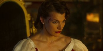Movie still from “Paradise Hills” (2019), directed by Alice Waddington – A person with a scar on their face; Close Up shot, Over the shoulder angle