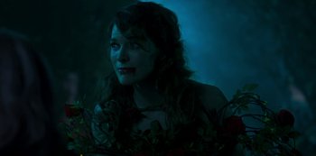 Movie still from “Paradise Hills” (2019), directed by Alice Waddington – A woman with long dark hair and red lipstick; Close Up shot, High angle