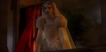 Movie still from “Paradise Hills” (2019), directed by Alice Waddington – A woman dressed in a wedding gown and veil; Medium shot, Over the shoulder angle