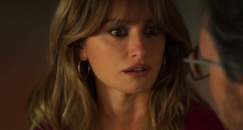 Movie still from “Parallel Mothers” (2021), directed by Pedro Almodóvar – A person with long brown hair; Close Up shot, Over the shoulder angle