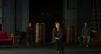 Movie still from “Parallel Mothers” (2021), directed by Pedro Almodóvar – A woman sitting on a chair in front of another woman; Wide shot, High angle