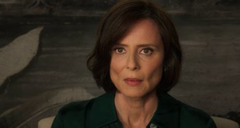 Movie still from “Parallel Mothers” (2021), directed by Pedro Almodóvar – A person wearing a green shirt; Close Up shot, Over the shoulder angle