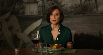 Movie still from “Parallel Mothers” (2021), directed by Pedro Almodóvar – A woman sitting in front of a bowl of fruit; Close Up shot, High angle