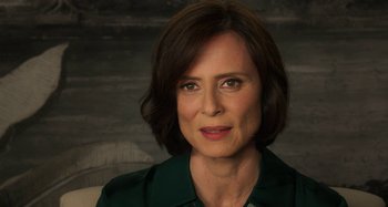 Movie still from “Parallel Mothers” (2021), directed by Pedro Almodóvar – A person wearing a green shirt; Close Up shot, Over the shoulder angle