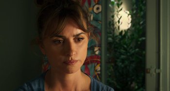 Movie still from “Parallel Mothers” (2021), directed by Pedro Almodóvar – A person looking at the camera; Close Up shot, Over the shoulder angle