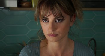 Movie still from “Parallel Mothers” (2021), directed by Pedro Almodóvar – A person wearing a blue shirt; Close Up shot, Over the shoulder angle