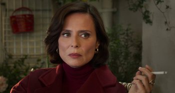 Movie still from “Parallel Mothers” (2021), directed by Pedro Almodóvar – A person wearing a red jacket; Close Up shot, Over the shoulder angle