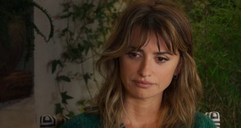 Movie still from “Parallel Mothers” (2021), directed by Pedro Almodóvar – A person wearing a green shirt; Close Up shot, Over the shoulder angle