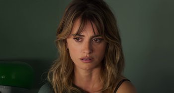 Movie still from “Parallel Mothers” (2021), directed by Pedro Almodóvar – A person with long brown hair; Close Up shot, Over the shoulder angle