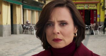 Movie still from “Parallel Mothers” (2021), directed by Pedro Almodóvar – A person wearing a red shirt; Close Up shot, Over the shoulder angle