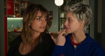 Movie still from “Parallel Mothers” (2021), directed by Pedro Almodóvar – A woman and a man are eating food together; Close Up shot, Over the shoulder angle
