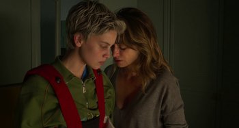 Movie still from “Parallel Mothers” (2021), directed by Pedro Almodóvar – Two people are looking at each other with their eyes closed; Close Up shot, Over the shoulder angle